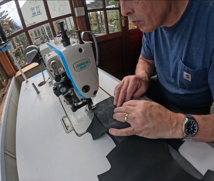 espoke automotive leatherwork being precision stitched at Pride Car Customs